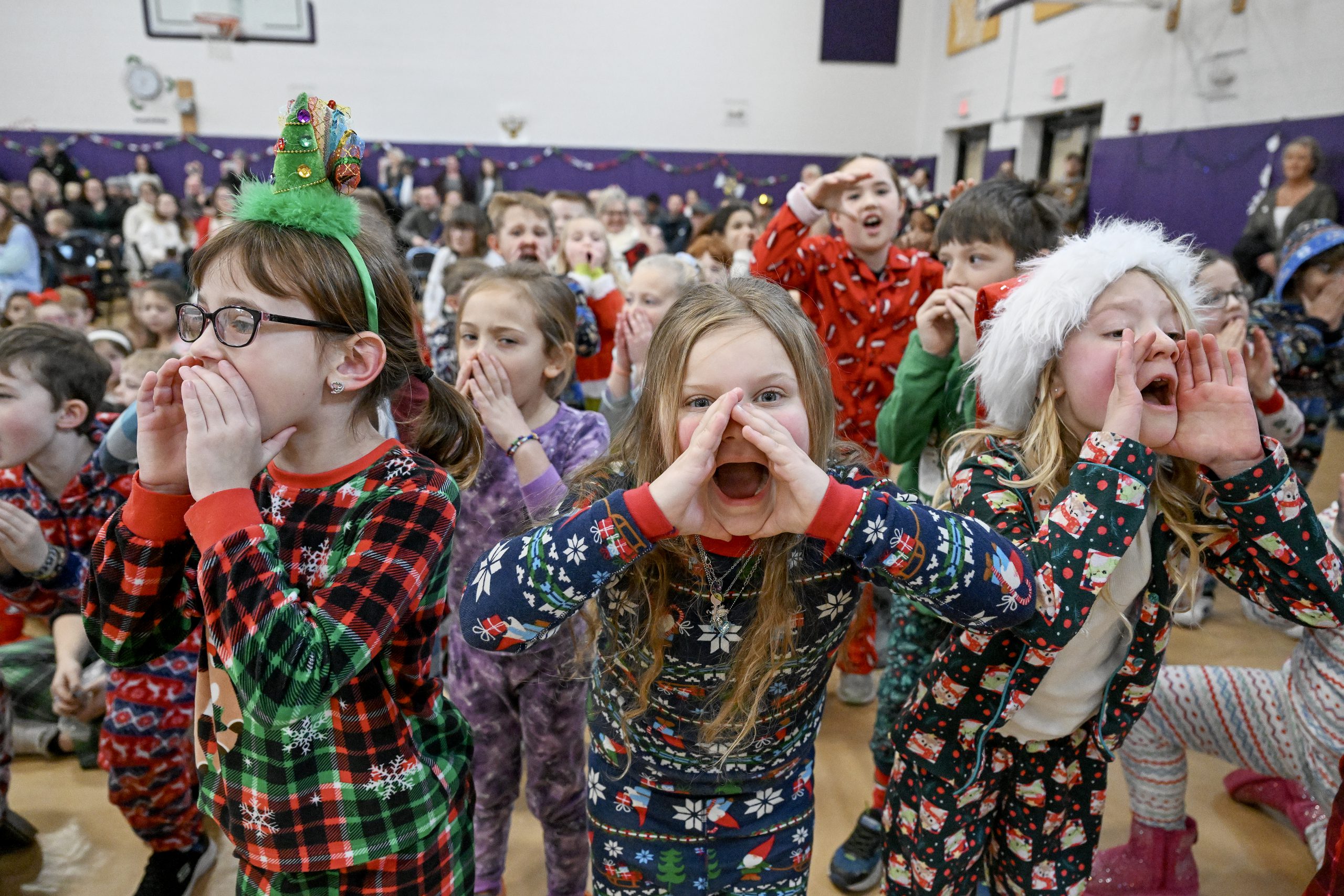 young children animatedly sing a Christmas song