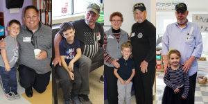 adult veterans pose with their children at school