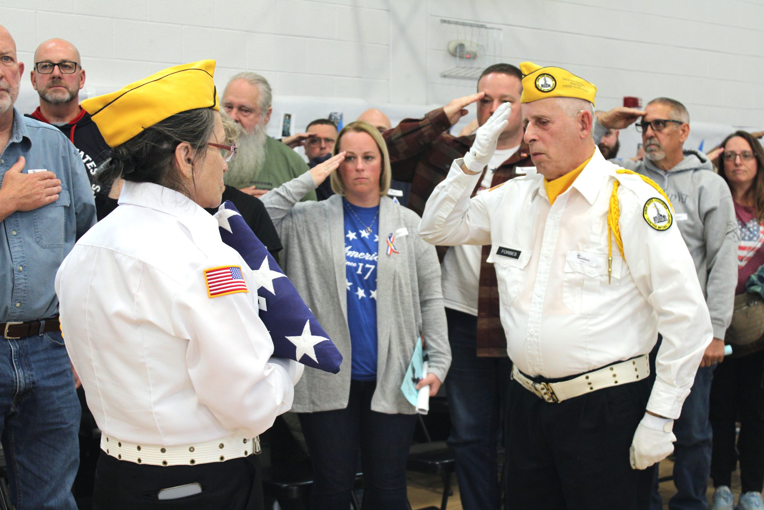 military veterans salute the flag